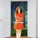 A digital collage of a stylized figure in a bright red dress and white socks, wearing oversized white sunglasses. The figure's face is blank and featureless. Text overlaid across the chest reads "i am not your erotic sonist." Behind the figure is a lush forest background with trees and grass visible through open white doors.